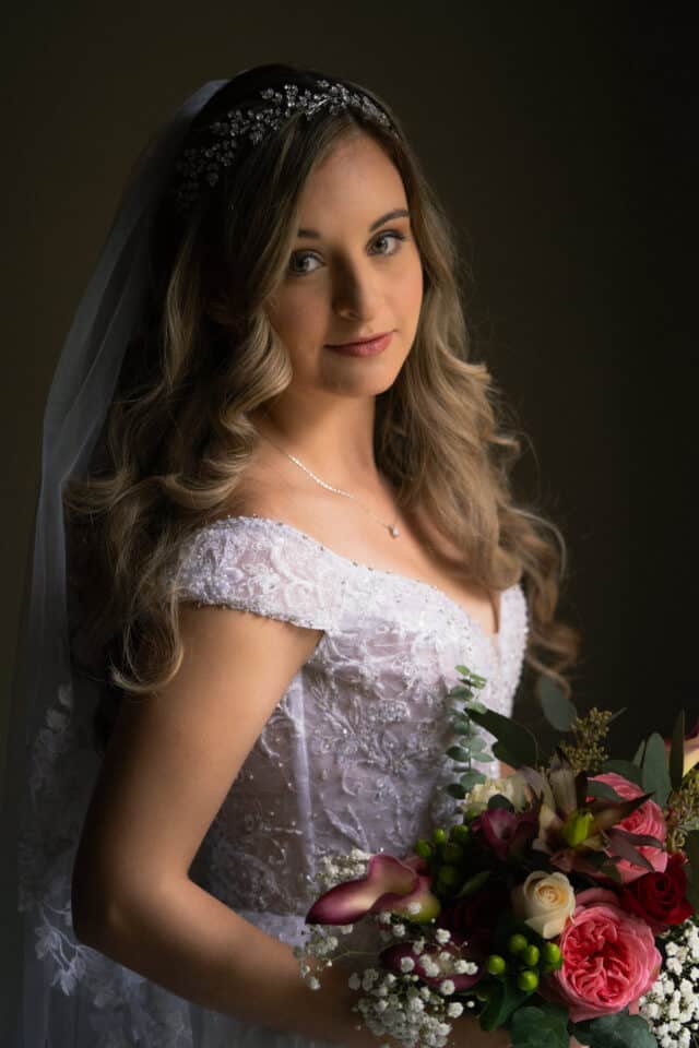 Bride in wedding dress looking at the camera