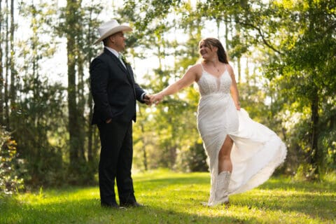 Bride and groom wtih greenery in the background